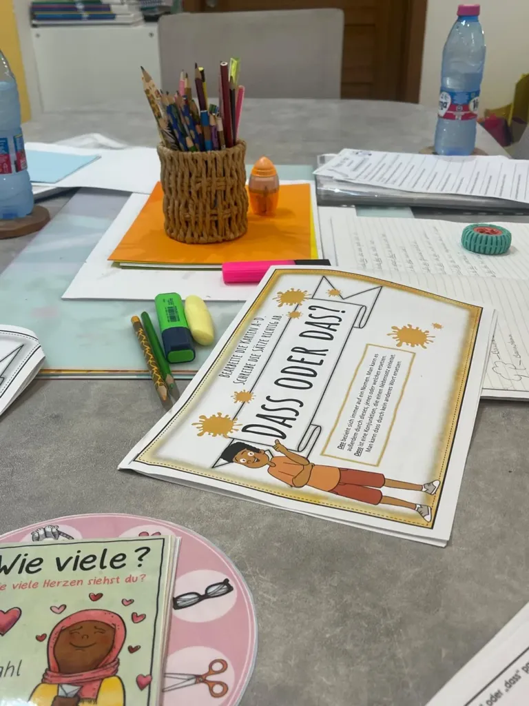 German grammar worksheet for children on the classroom table