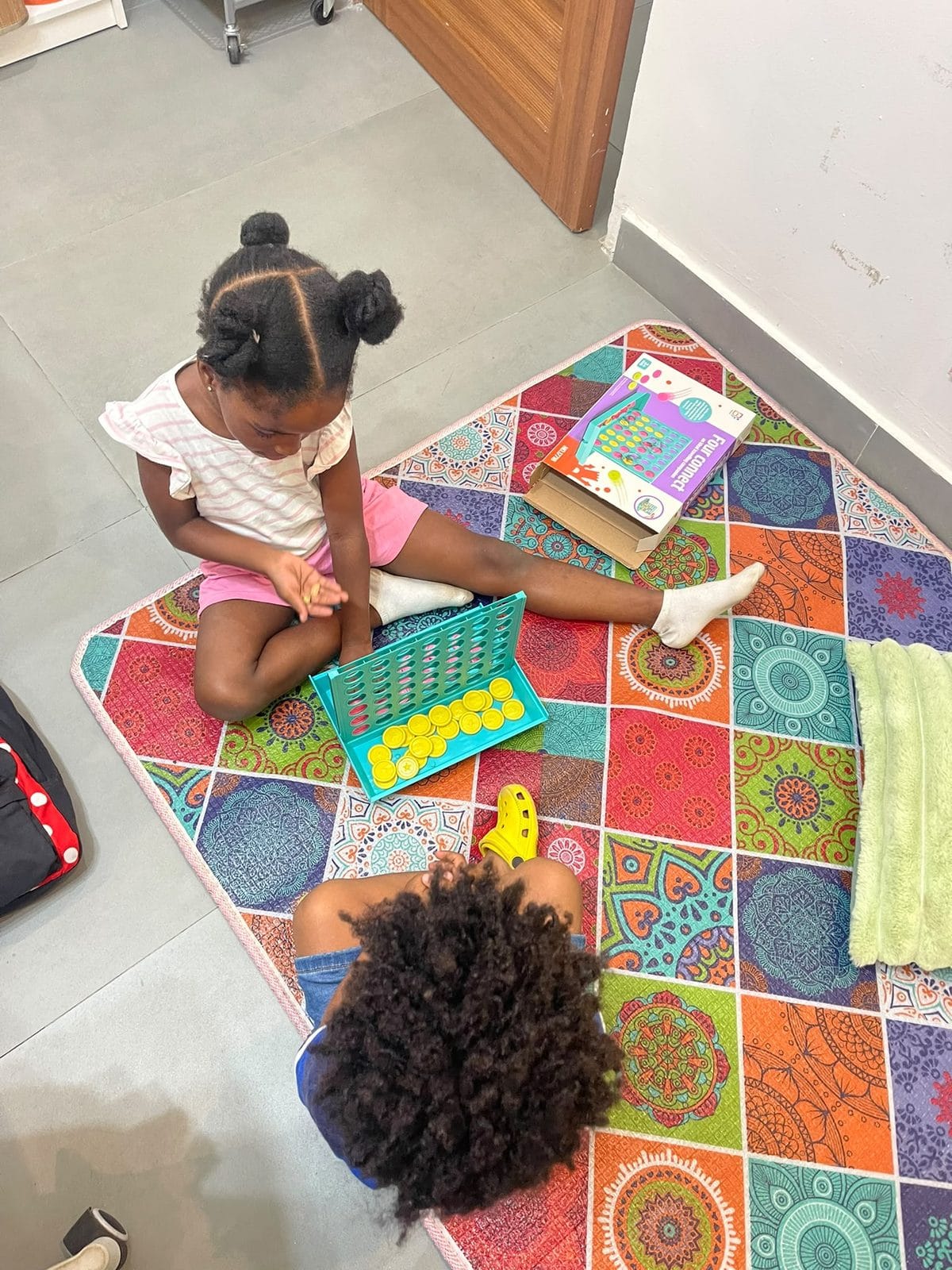 A preschool child playing a German learning game at Studyfreunde in Accra