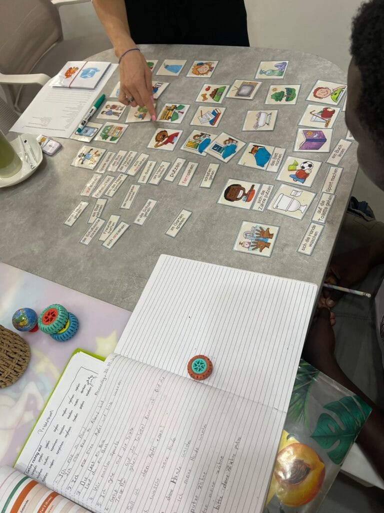 German word cards and learning materials on the table at Studyfreunde in Accra